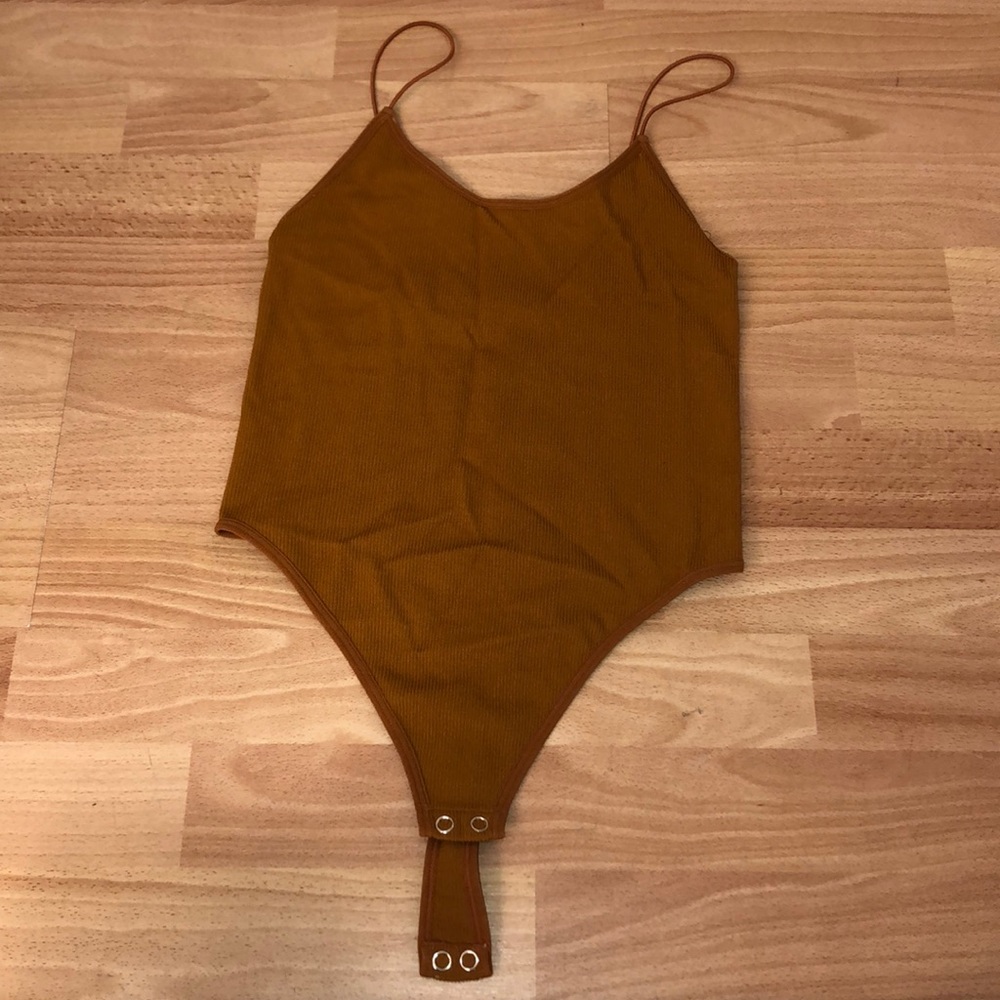 rusty orange body suit